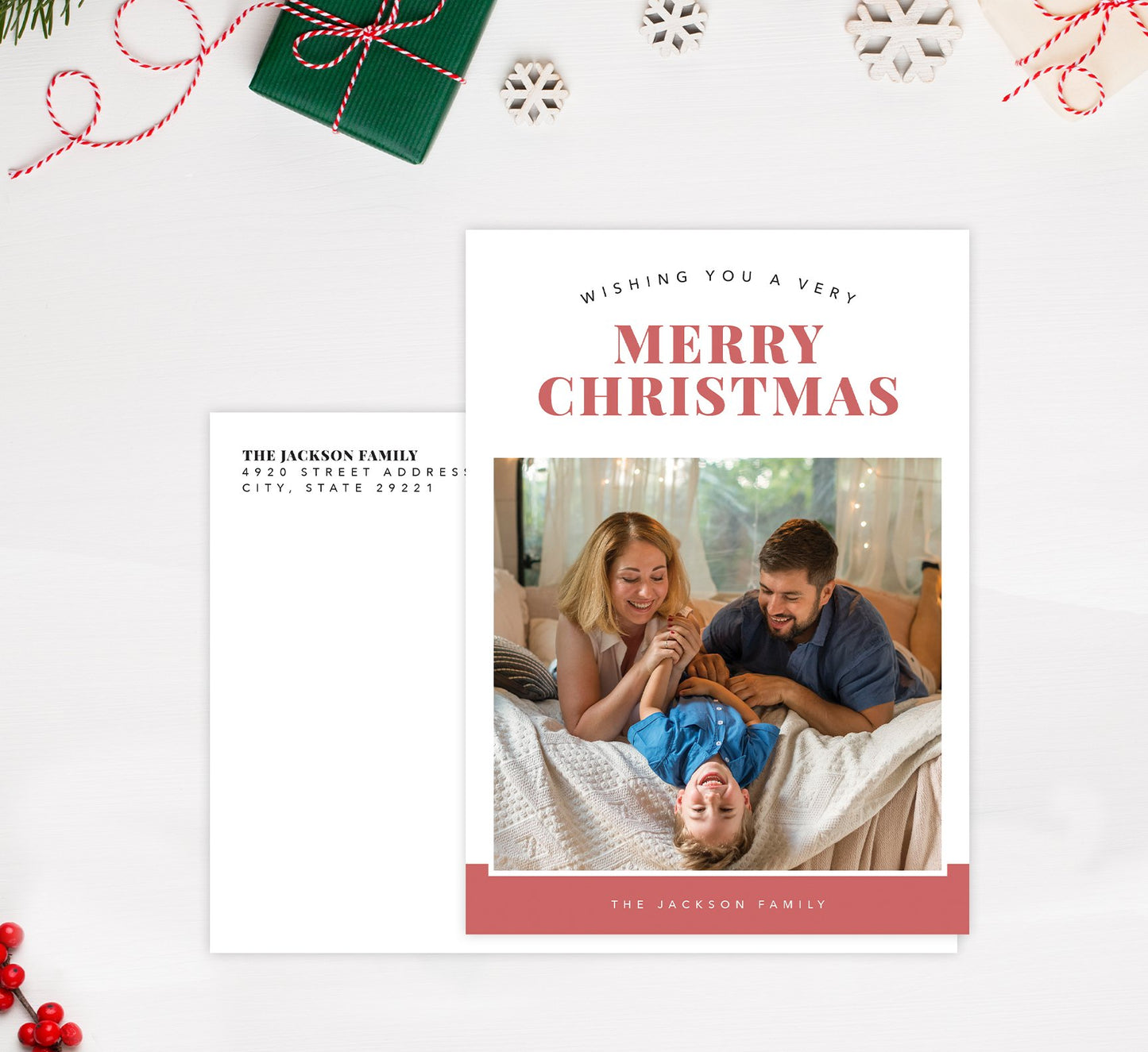 Happy Pink Holiday Card Mockup; Holiday card with envelope and return address printed on it.