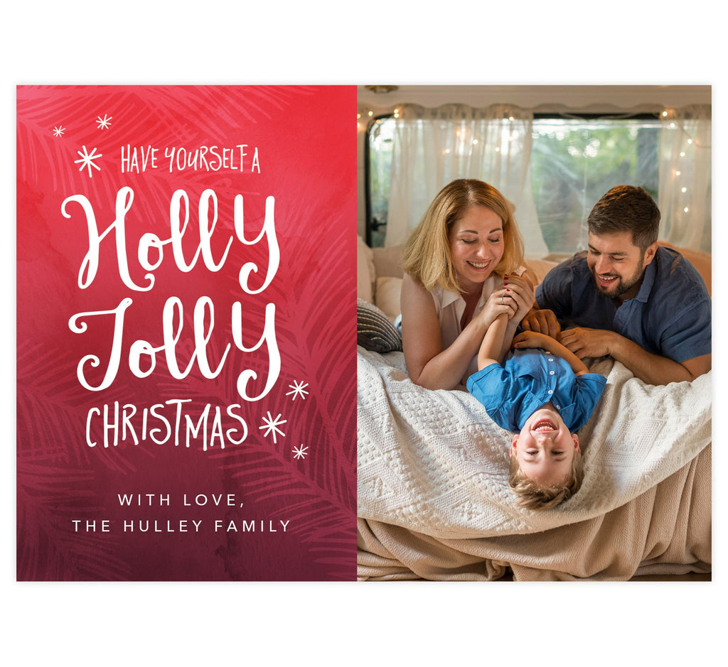 Holly Jolly Holiday Card; Red background with pink designs, hand written font to send Christmas wishes, and one large spot for your image.