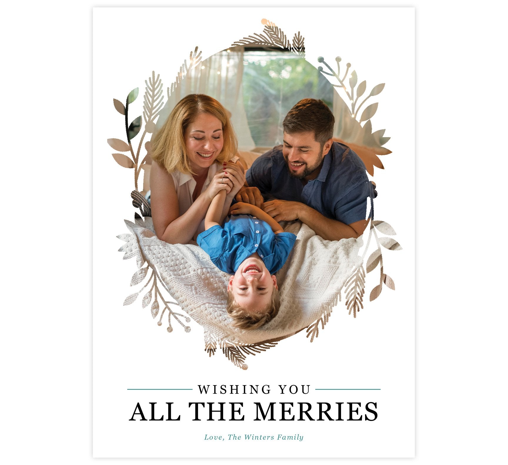 All the Merries Holiday Card; White background with large image in the middle and wreath design around the edges of the photo. Black text that says "Wishing you all the merries" and teal text with the signature.