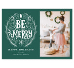 Load image into Gallery viewer, Be Merry Holiday Card; Teal/Green background with drawn &quot;Be Merry&quot; design in white. &#39;Happy holidays&#39; written under the be merry design and spot for photo on the right.
