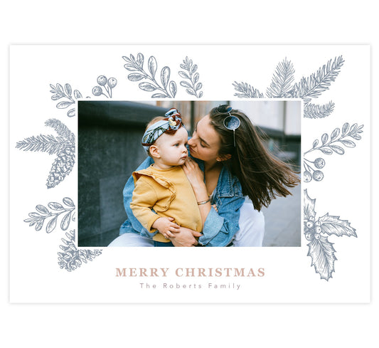 Christmas Frame Holiday Card; White background with hand drawn winter elements in a frame around the 1 image spot. "Merry Christmas" under the image in rose gold.