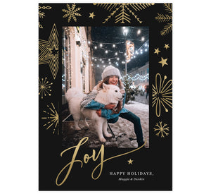Gold Joy Holiday Card; Dark black background with gold snowflakes and one image spot in the middle. Large, gold "Joy" is at the bottom overlapping the bottom of the image.
