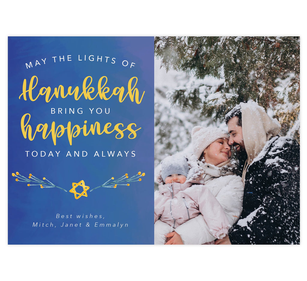 Hanukkah Happiness Holiday Card; Subtle blue watercolor background with large image spot on right side. Text on the left side in white and yellow "May the lights of hanukkah bring you happiness today and always."