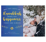 Load image into Gallery viewer, Hanukkah Happiness Holiday Card; Subtle blue watercolor background with large image spot on right side. Text on the left side in white and yellow &quot;May the lights of hanukkah bring you happiness today and always.&quot;
