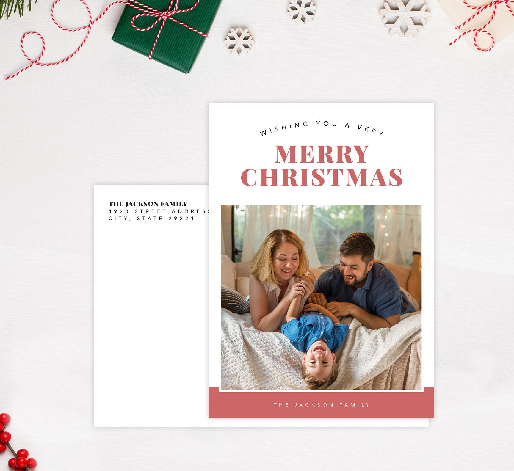 Happy Pink Holiday Card Mockup; Holiday card with envelope and return address printed on it. 