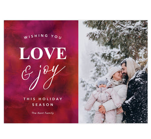 Love and Joy Holiday Card; Red and pink watercolor background with white text and one image spot.