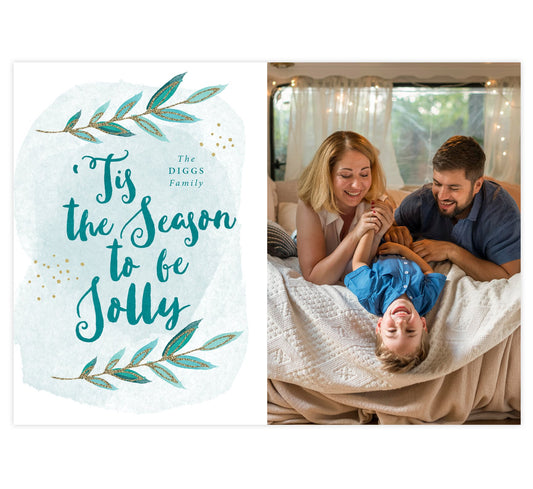 Tis the Season Holiday Card; White background with one large image spot and blue and gold watercolor "'Tis the season to by jolly" graphic on the left side.