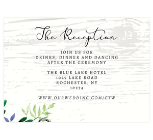 Elegant Purple Watercolor Wedding Reception Card; white washed wood background with black text and greenery in the bottom left corner.
