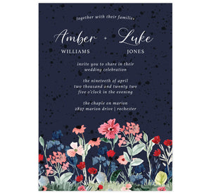 Watercolor Wildflower wedding invitation; textured dark blue background with bright white text and watercolor florals at the bottom edge