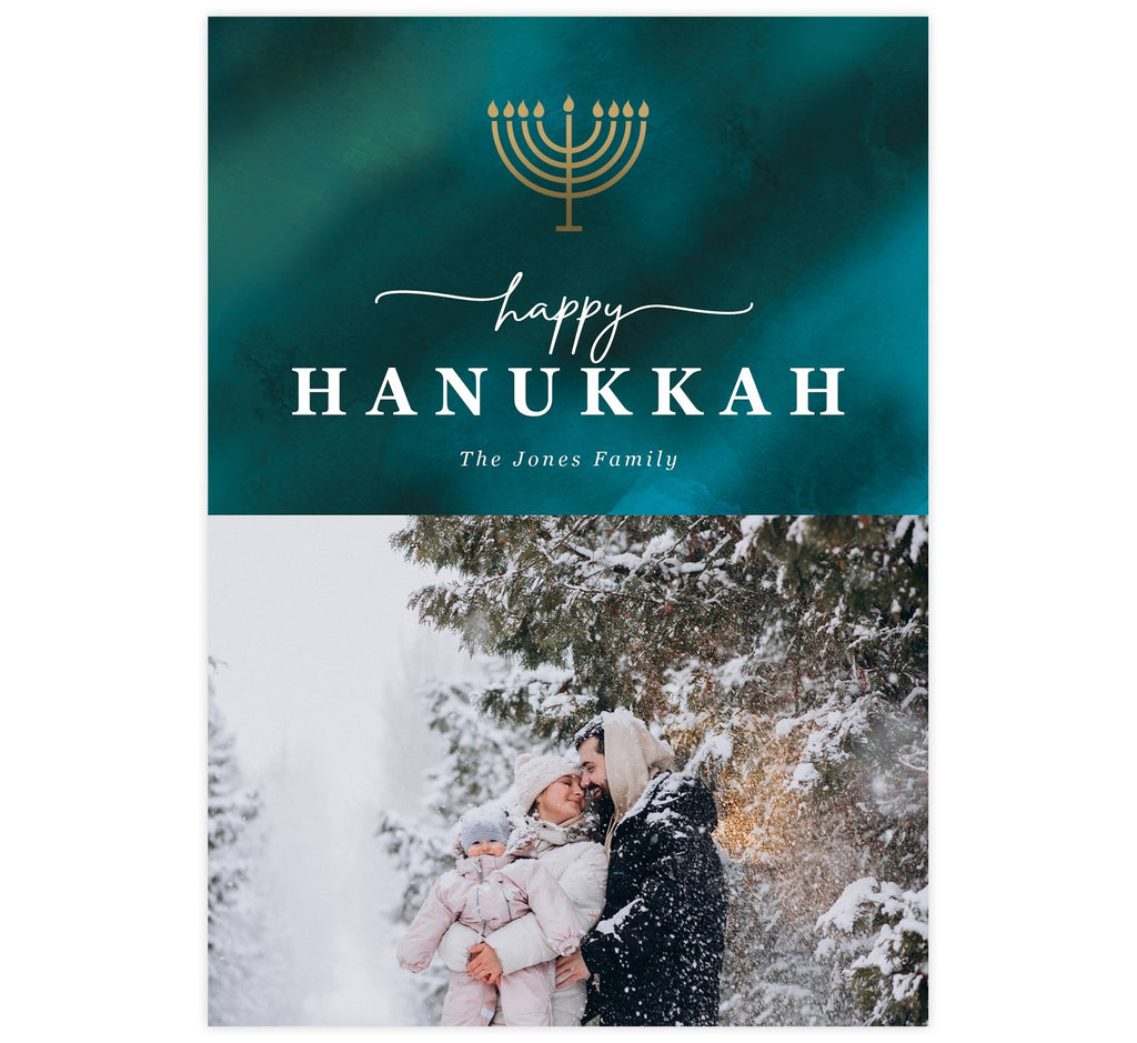 Watercolor Blues Holiday Card; Dark teal watercolor background with gold menorah at the top, white text and spot for one image.