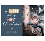 Load image into Gallery viewer, Woof Holiday Card; Dark, muted blue background with white text, a tan paw print and one photo spot.
